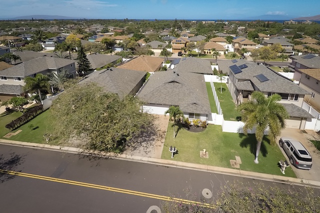 Pi'ilani Village Homes 2 An Aerial View of Pi'ilani Village Homes with the ocean in the distance.