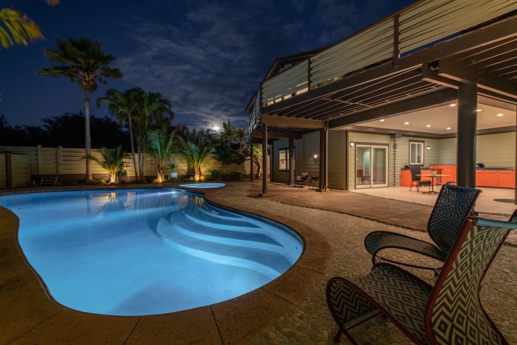 The moon rises over the pool area of 43 Nonohe in Spreckelsville